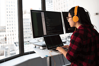 Adult Coding Overlooking City